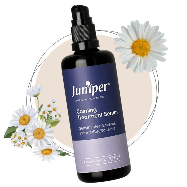 Juniper Calming Treatment Serum in a sleek bottle, with chamomile, to soothe and nourish sensitive skin.