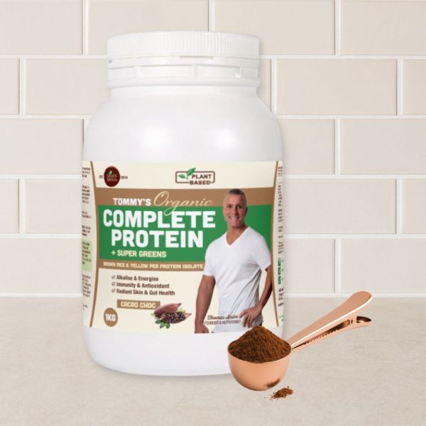 Rose Gold Scoop In Action Scooping Tommy's Protein Powder